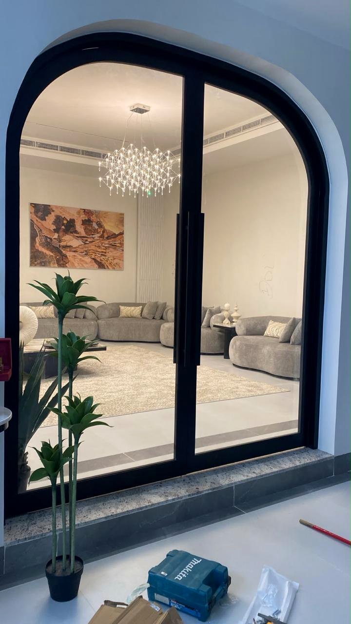 Arched double glass door with black aluminium frame